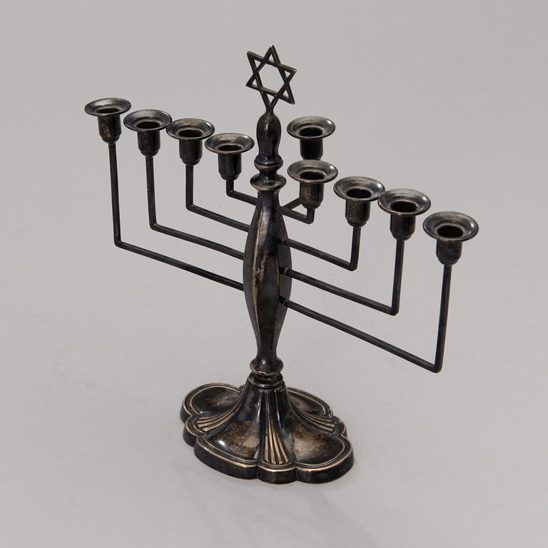 A chanukiah / menorah silver candelabrum for nine candles, mark of Britton, Gould & Co, Birmingham 1933.