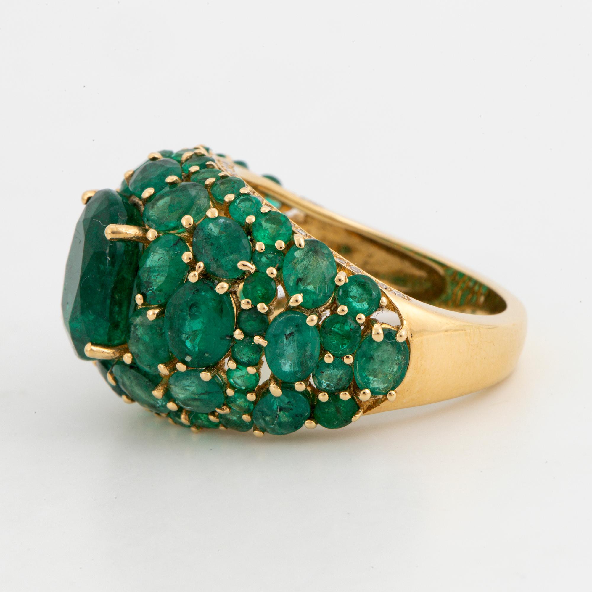 Emerald and brilliant-cut diamond ring.