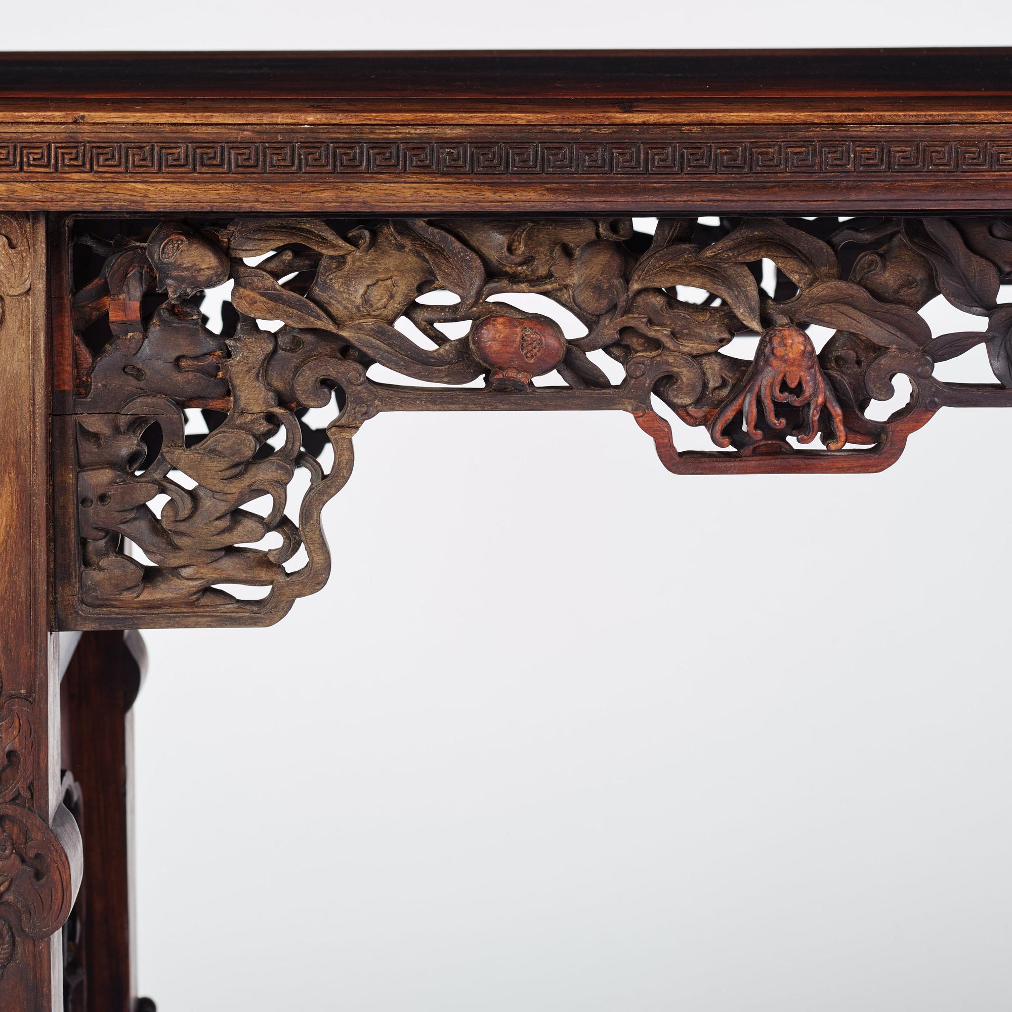 A massive zitan recessed-leg long table 'Jiaotousun Qiotouan', Qing dynasty, 19th century.