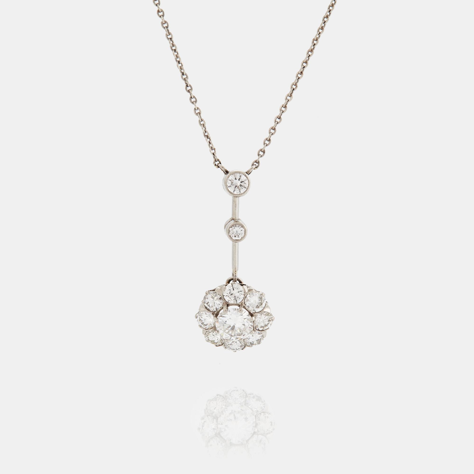 A NECKLACE set with a round brilliant-cut diamond.