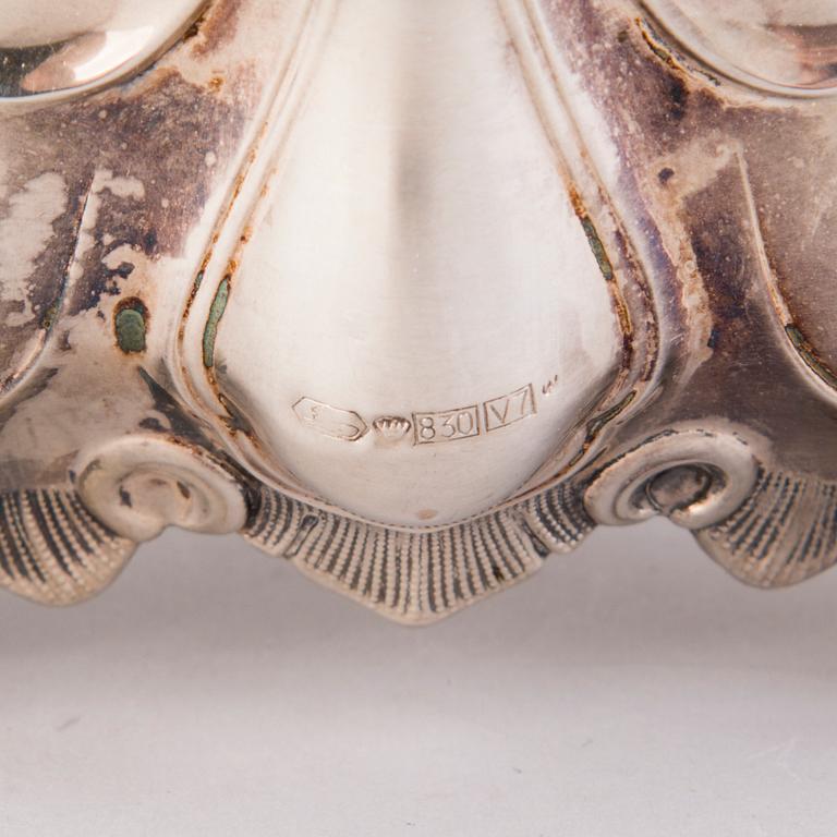 CANDELABRUM AND CANDLESTICK, silver, Kultakeskus Oy, Hämeenlinna, 1965 and 1975.