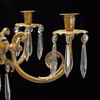 A brass chandelair, around the year 1900.