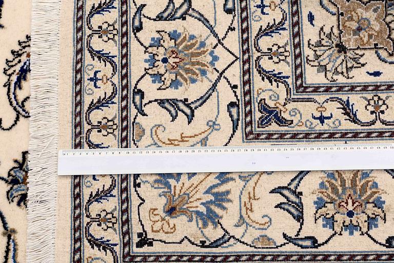 A CARPET, Nain, part silk, around 296 x 197 cm.