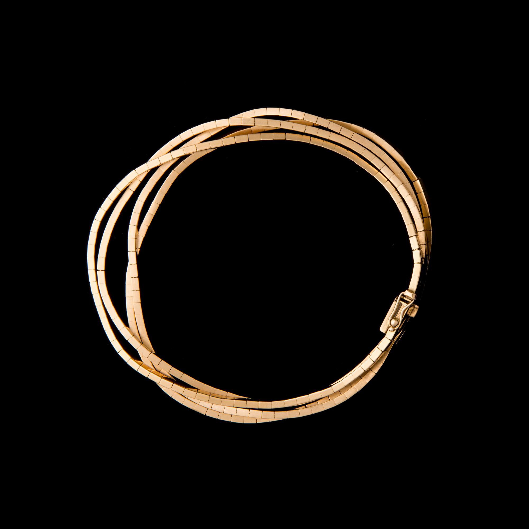 ARMKED, 18K guld. Uno a Erre. Vikt ca 29,5 g.