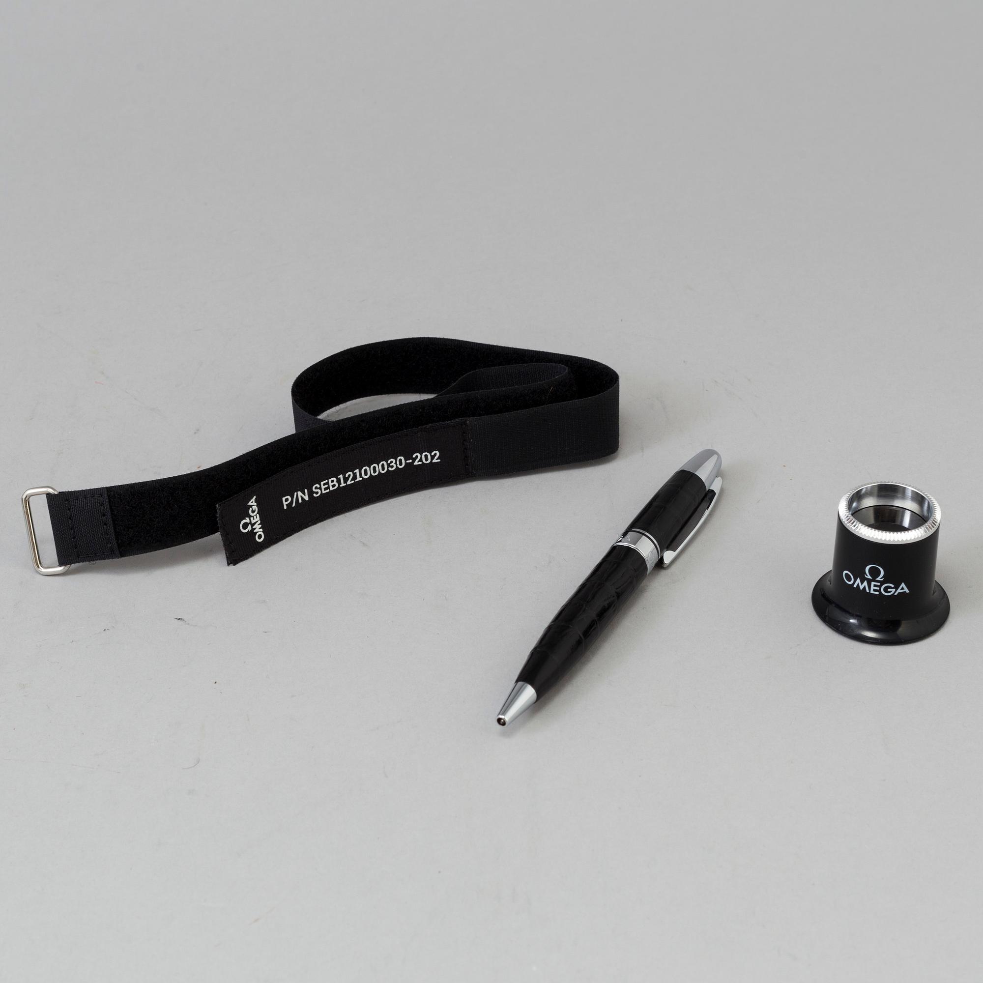 OMEGA, Pen / Loupe / Velcro strap.