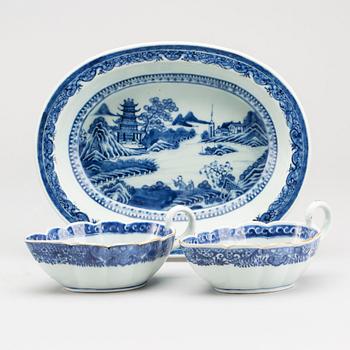 A blue and white Chinese Qianlong porcealin pair of sauce boats and a serving dish.