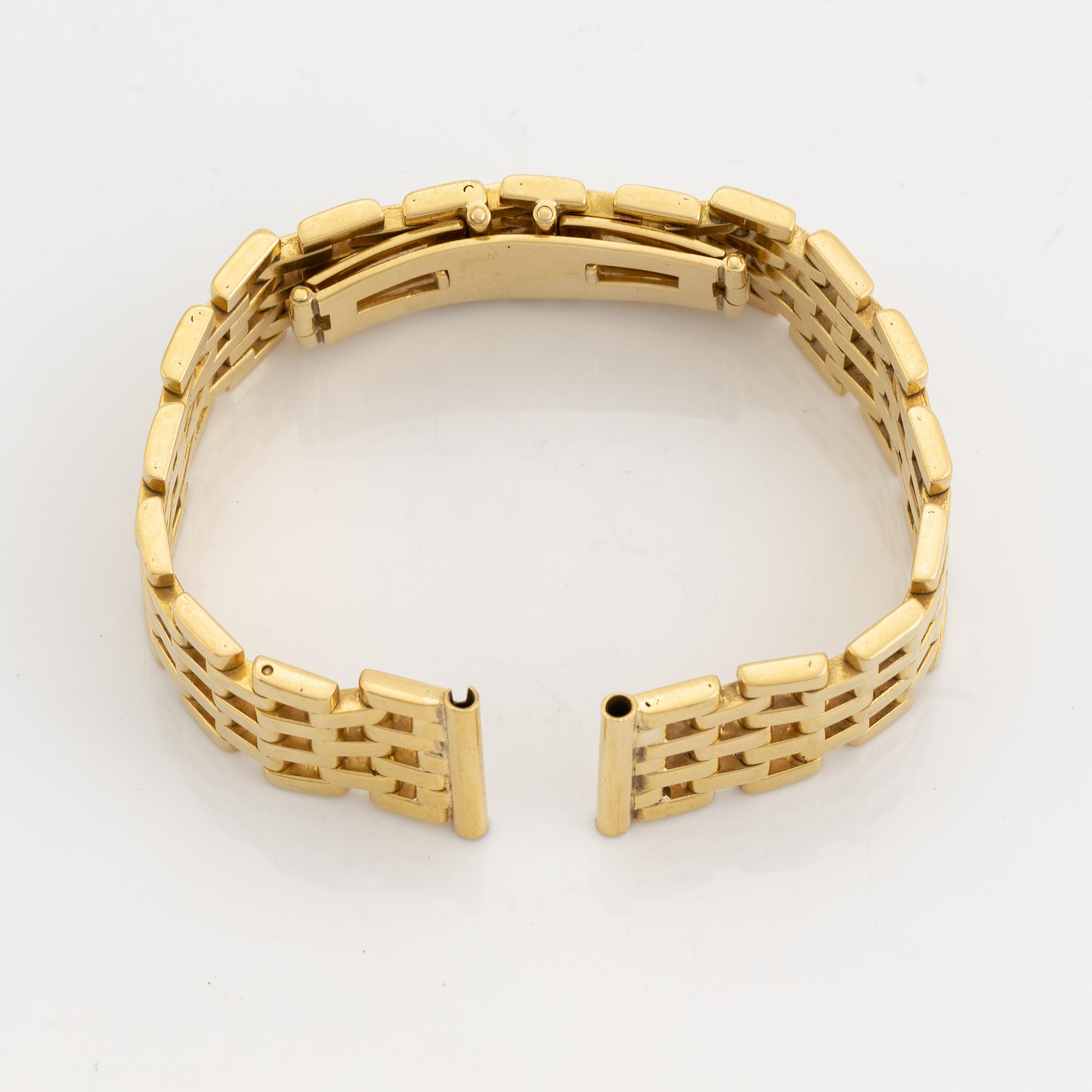 An 18K gold watch bracelet.