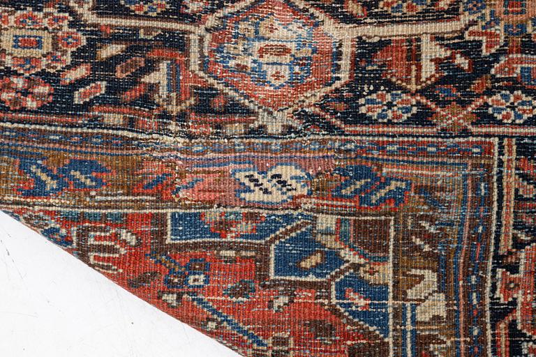 An antique Heriz carpet, west Persia, c. 333 x 238 cm.
