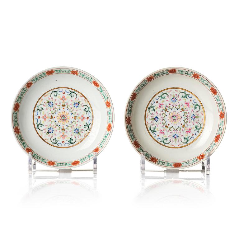 A pair of yellow-ground famille rose 'lotus' dishes, Qing dynasty, Jiaqing red seal mark and of the period (1796-1820).