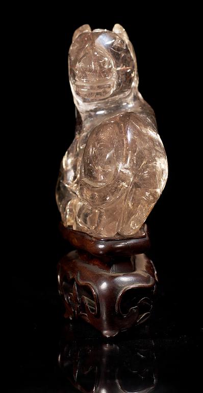 A smoky quartz figure of a reclining horse, China early 20th Century.