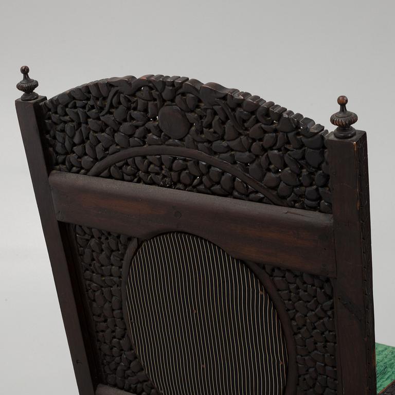 A pair of Angloindian carved chairs, India, 19th century, in so called 'Bombay style'.