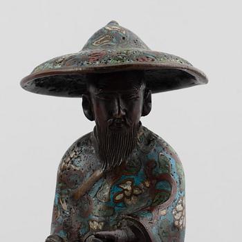 A Chinese bronze and cloissoné figurine on a mule, late Qing/early 20th century.