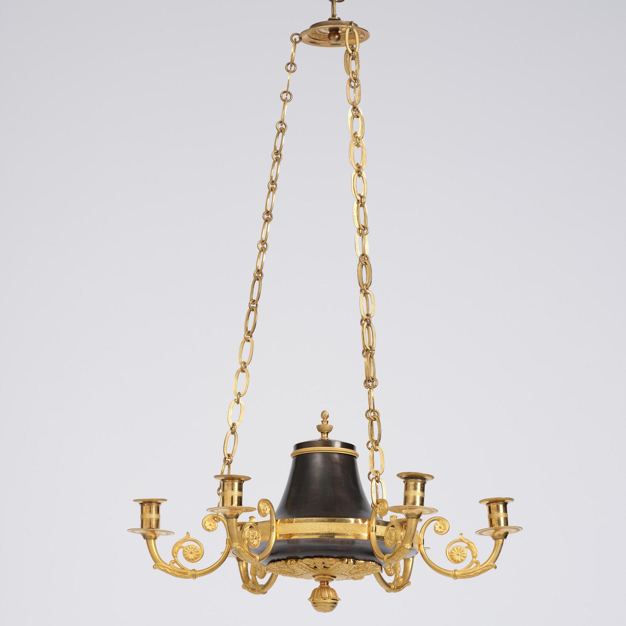 A Swedish Empire ormolu and patinated six-branch chandelier, Stockholm, early 19th century.