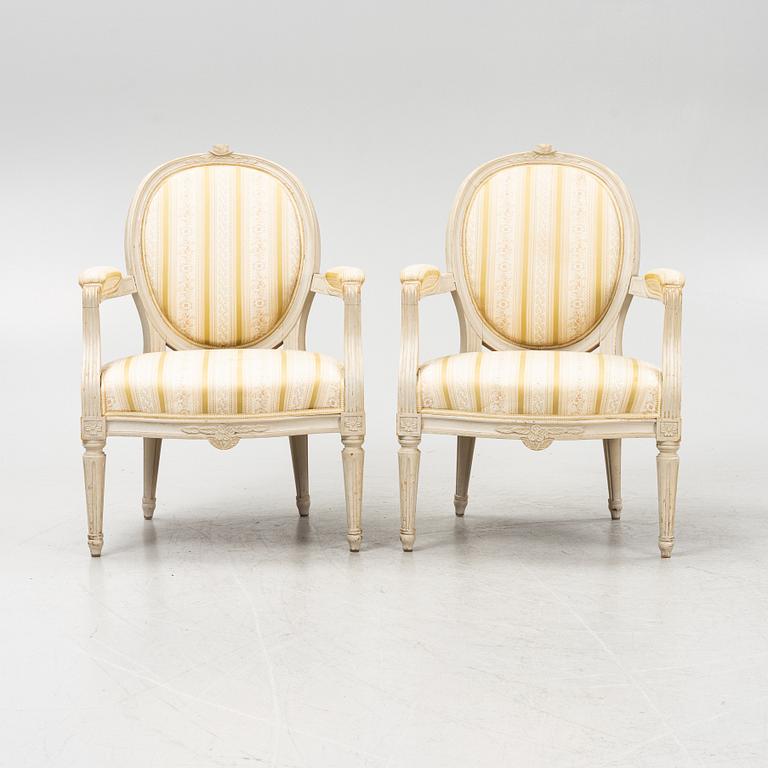 A pair of Gustavian style armchairs signed J.G.A, mid 20th century.