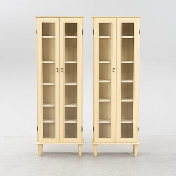 A pair of Gustavian style book cabinets, 21st century.