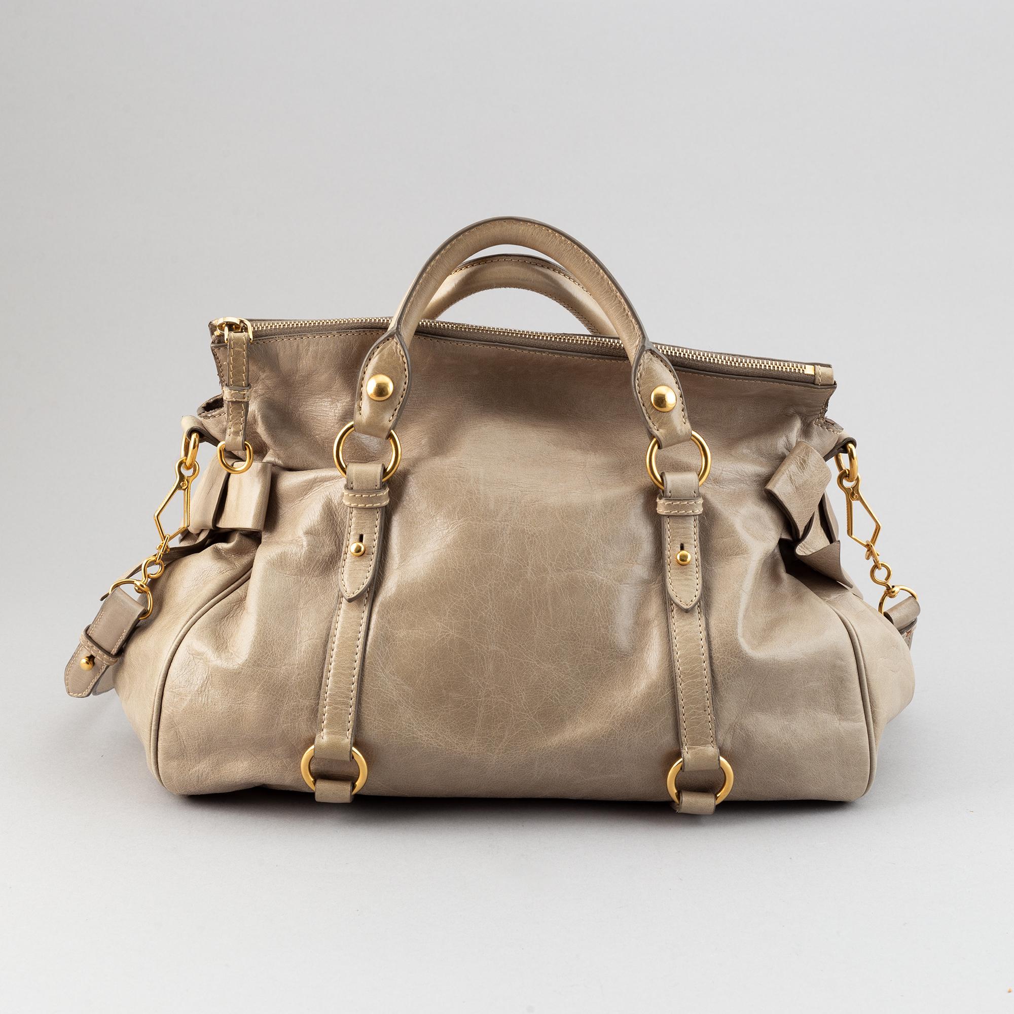 Miu Miu, a leather handbag.