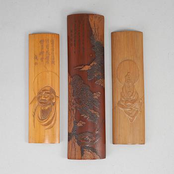 A set of three bamboo wrist rests, presumably early 20th Century, with inscriptions.