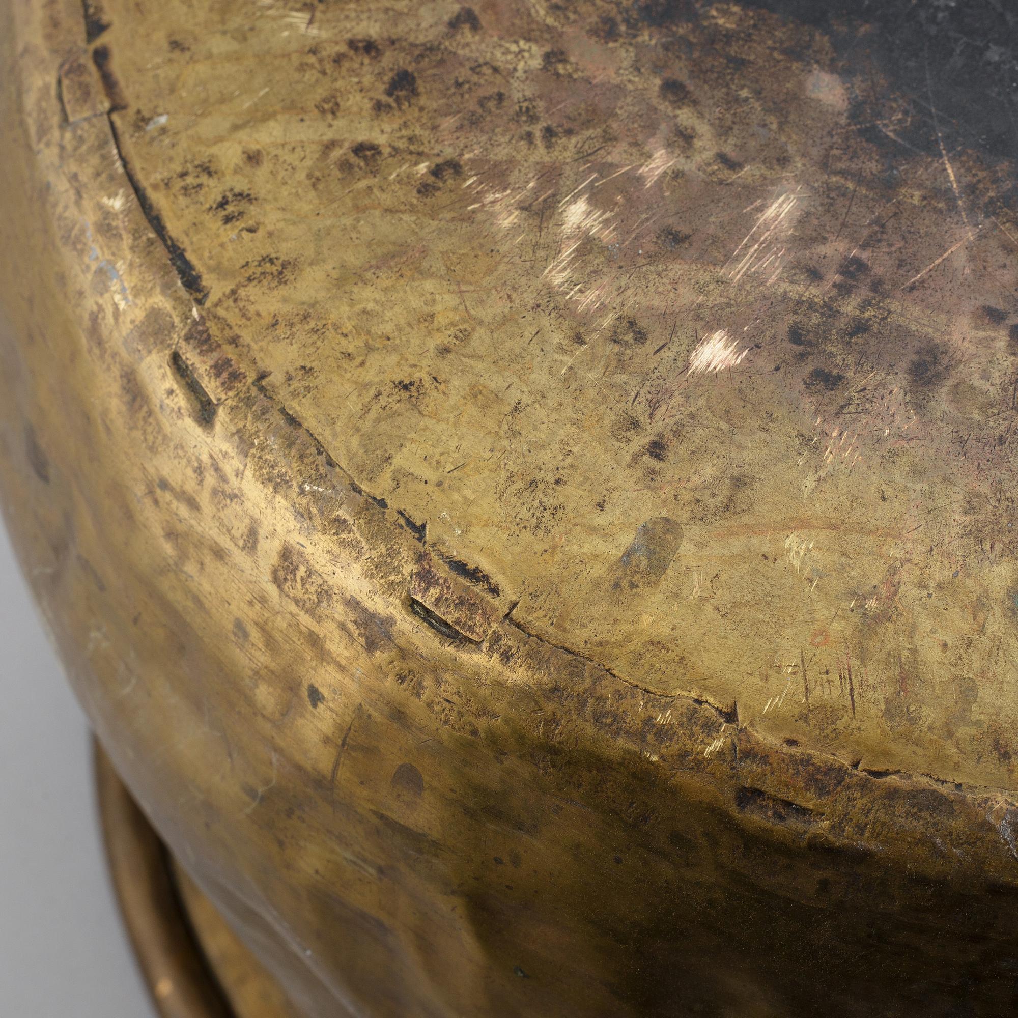 A large 18th century brass cauldron.