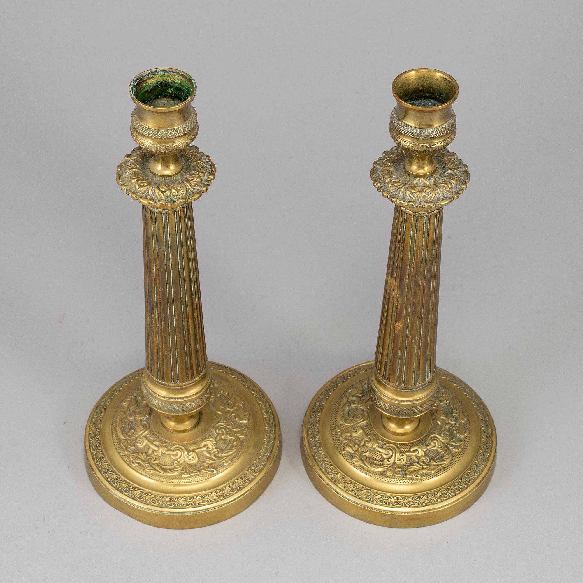 A pair of empire bronze candlesticks, first half of the 19th century.