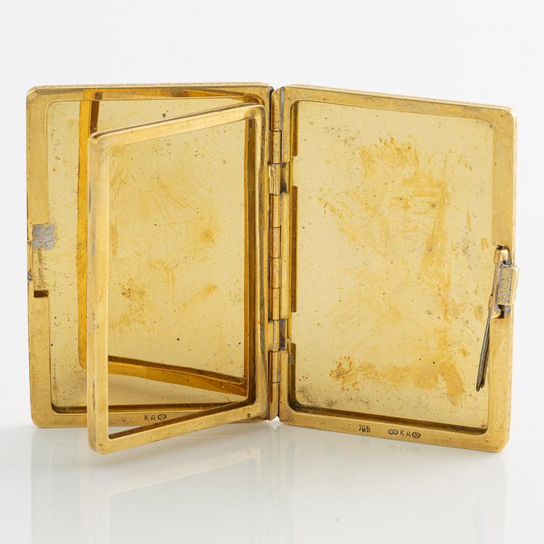 Travel photo album, 18K gold, with monogram.