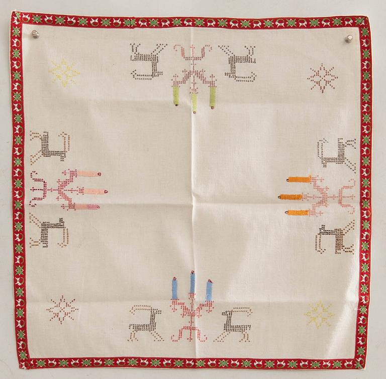 A collection of Christmas tablecloths 12 pcs first half/mid 20th century.