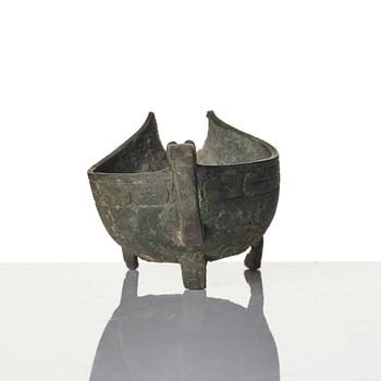 A Chinese brushpot, Qing dynasty, circa 1900. An archaistic bronze ewer and a silvered South East Asian bowl with stand.