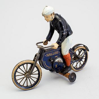 A partially hand painted tinplate Lehmann Halloh motorcycle, Germany. In production 1914-41.