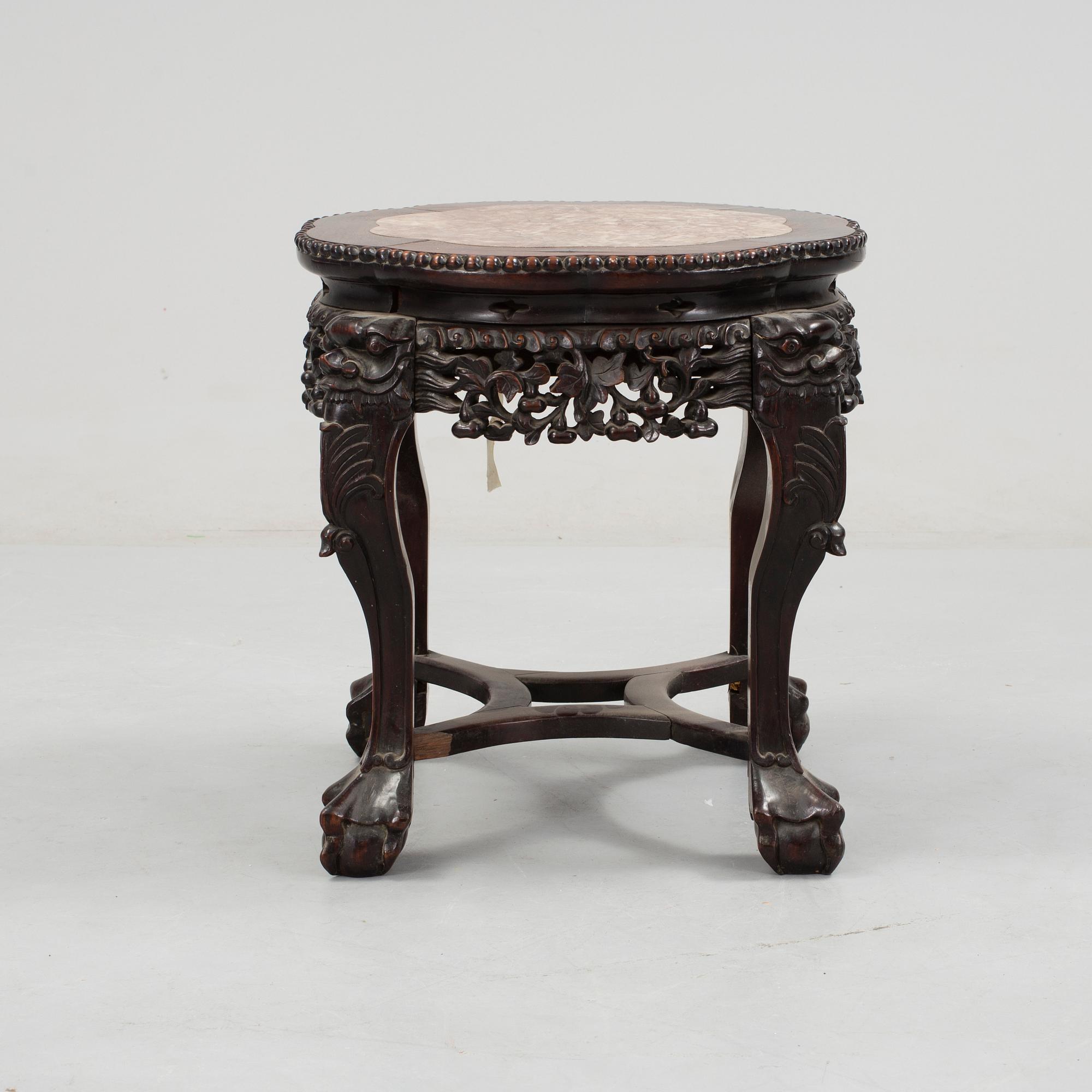 A Chinese hardwood table with marble top, 20th Century.