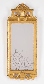A gustavian giltwood and parcel-gilt mirror by Johan Åkerblad (master 1758-1799).