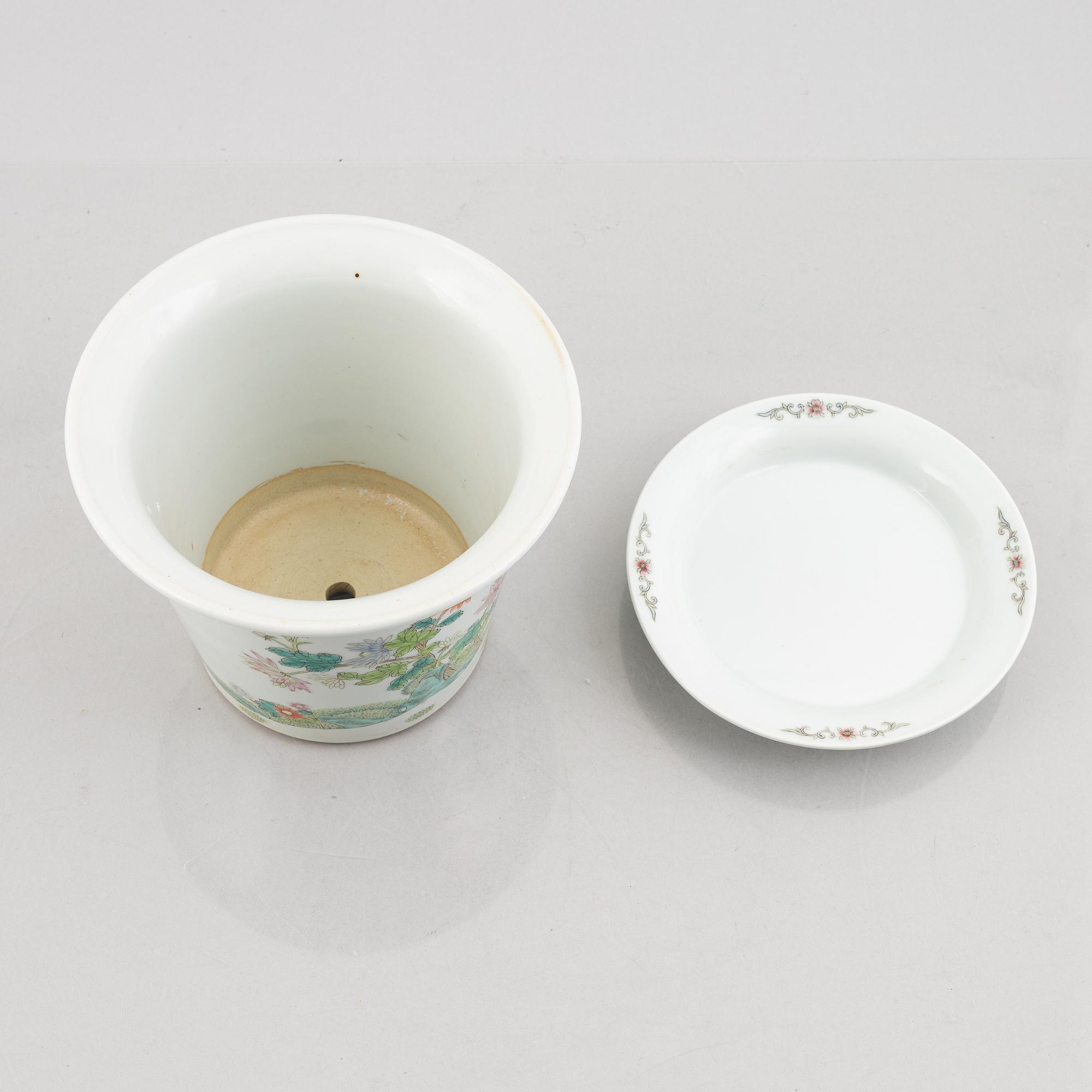 A porcelain plate and a flower pot with stand, China, 19th & 20th century.