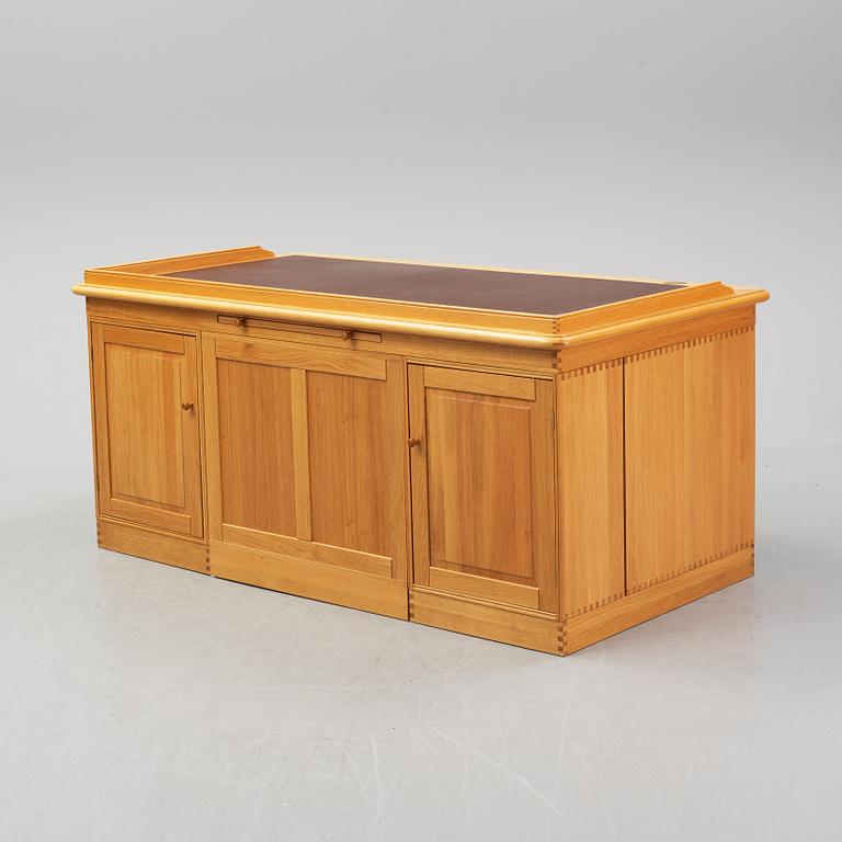 An oak writing desk by Finn N Hansen. End of the 20th Century.