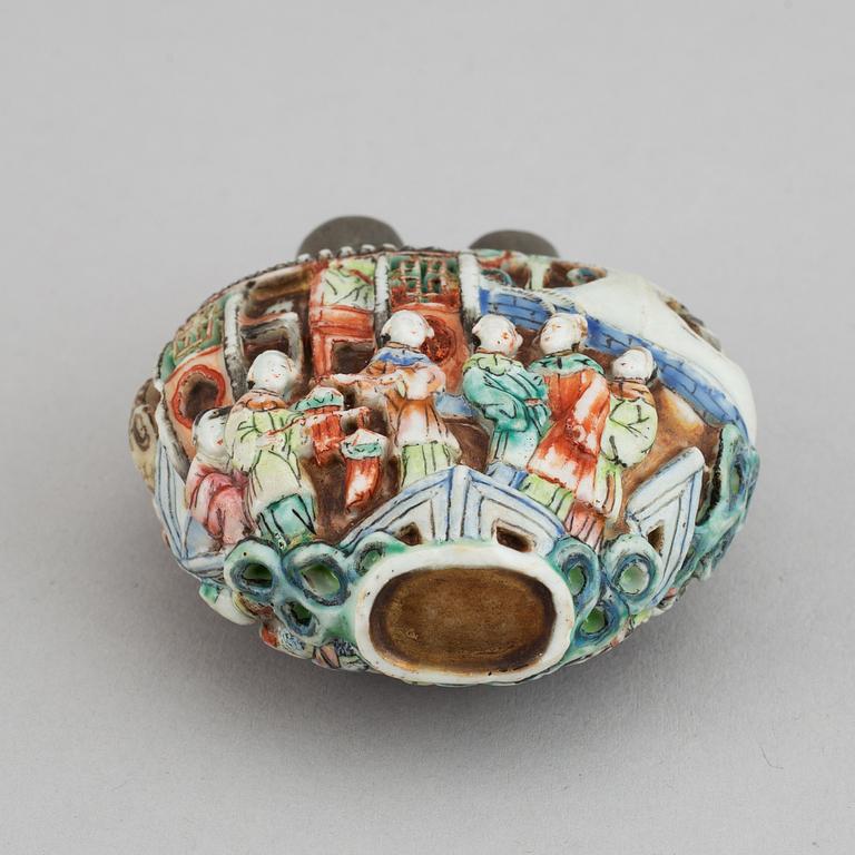 A famille rose moulded snuff bottle, Qing dynasty, 19th century.