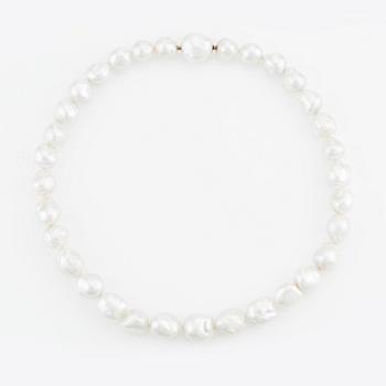 A Gaudy necklace with cultured South Sea pearls, a platinum bracelet, and two clasps.