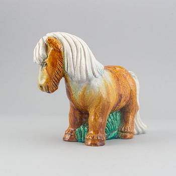 Gunnar Nylund, a stoneware sculpture of a work horse for Rörstrand signed.