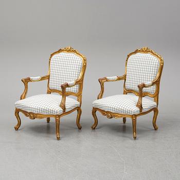 A pair of neo-rococo easy chairs, late 19th century.