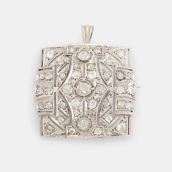 409. A brooch/pendant in 18K white gold set with old-cut diamonds.