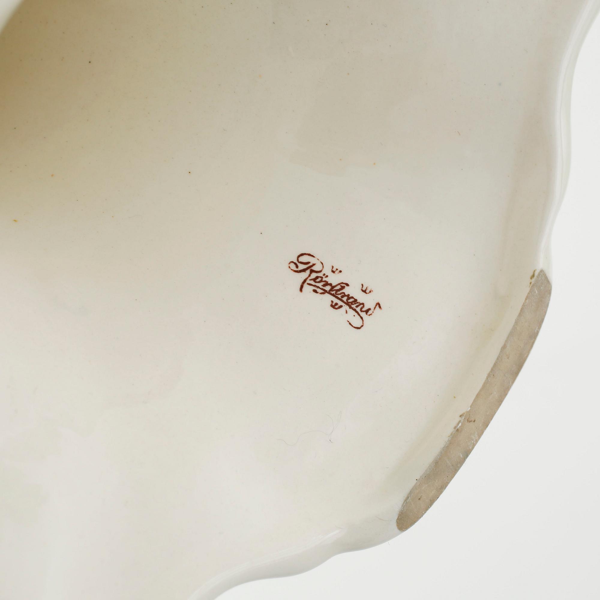 A candelabrum in ceramic named "Daldansen", Rörstrand, from early 20th century.