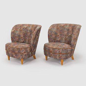 A pair of mid-20th century armchairs.