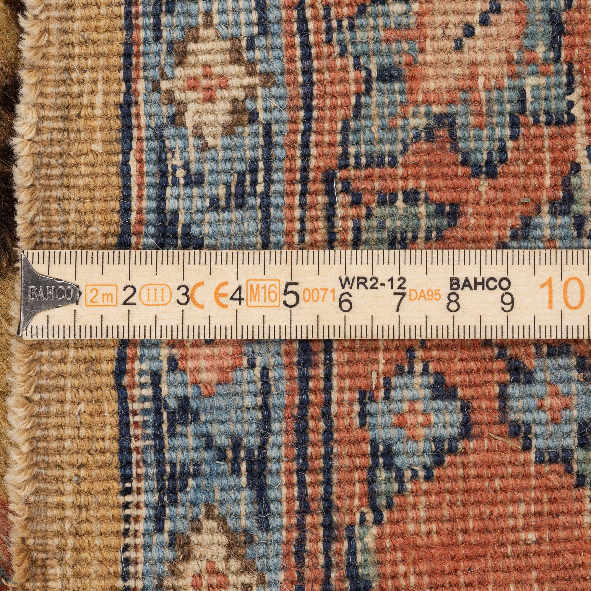 An Antique Tabriz carpet, Northwest Persia (Iran), signed Alabaf c 387 x 299 cm.