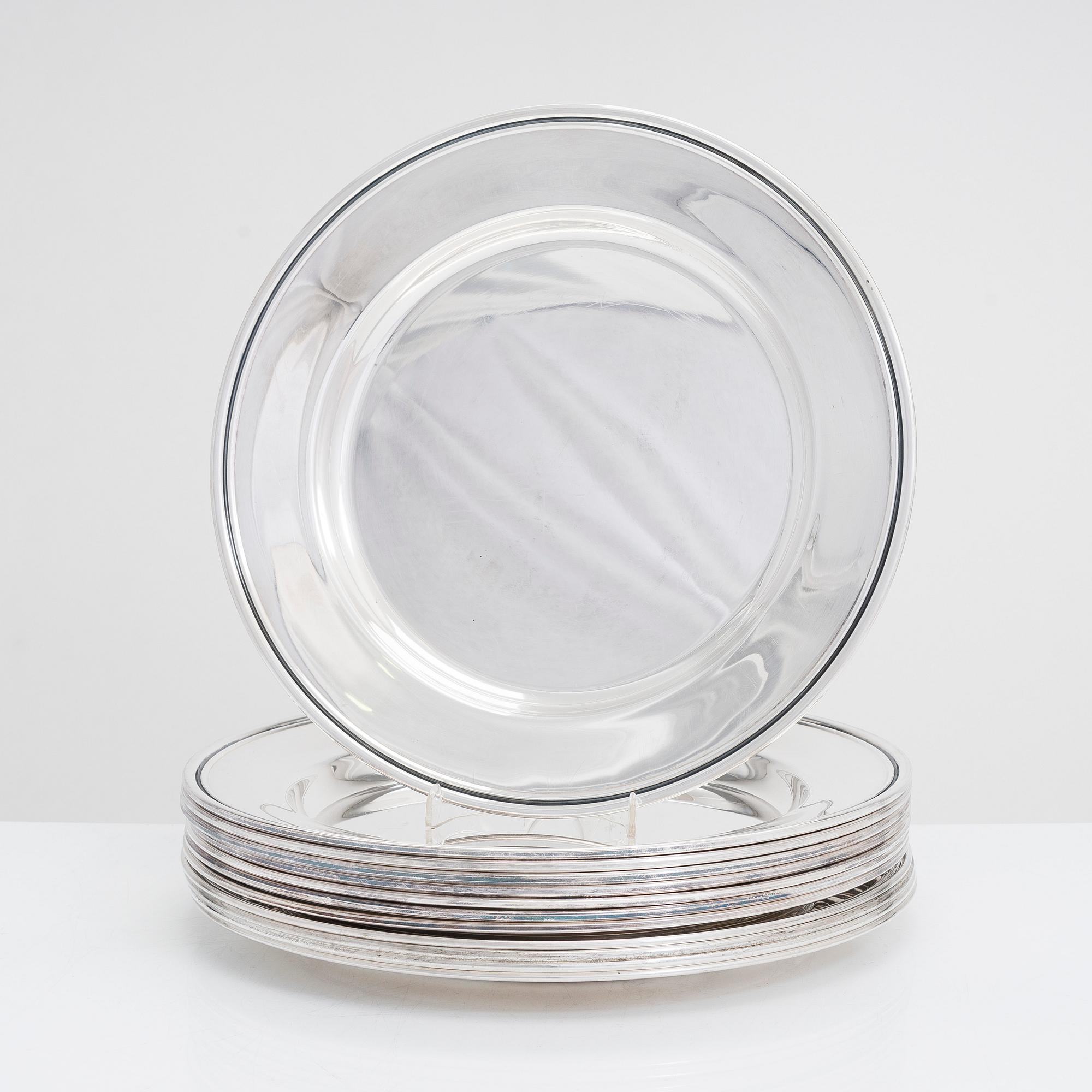 A 12-piece set of silver chargers, makers' marks of Hugo Grün, S.H. Jörgensen..., Denmark, around mid-20th century.