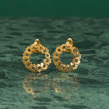 A pair of earrings by CHANEL.