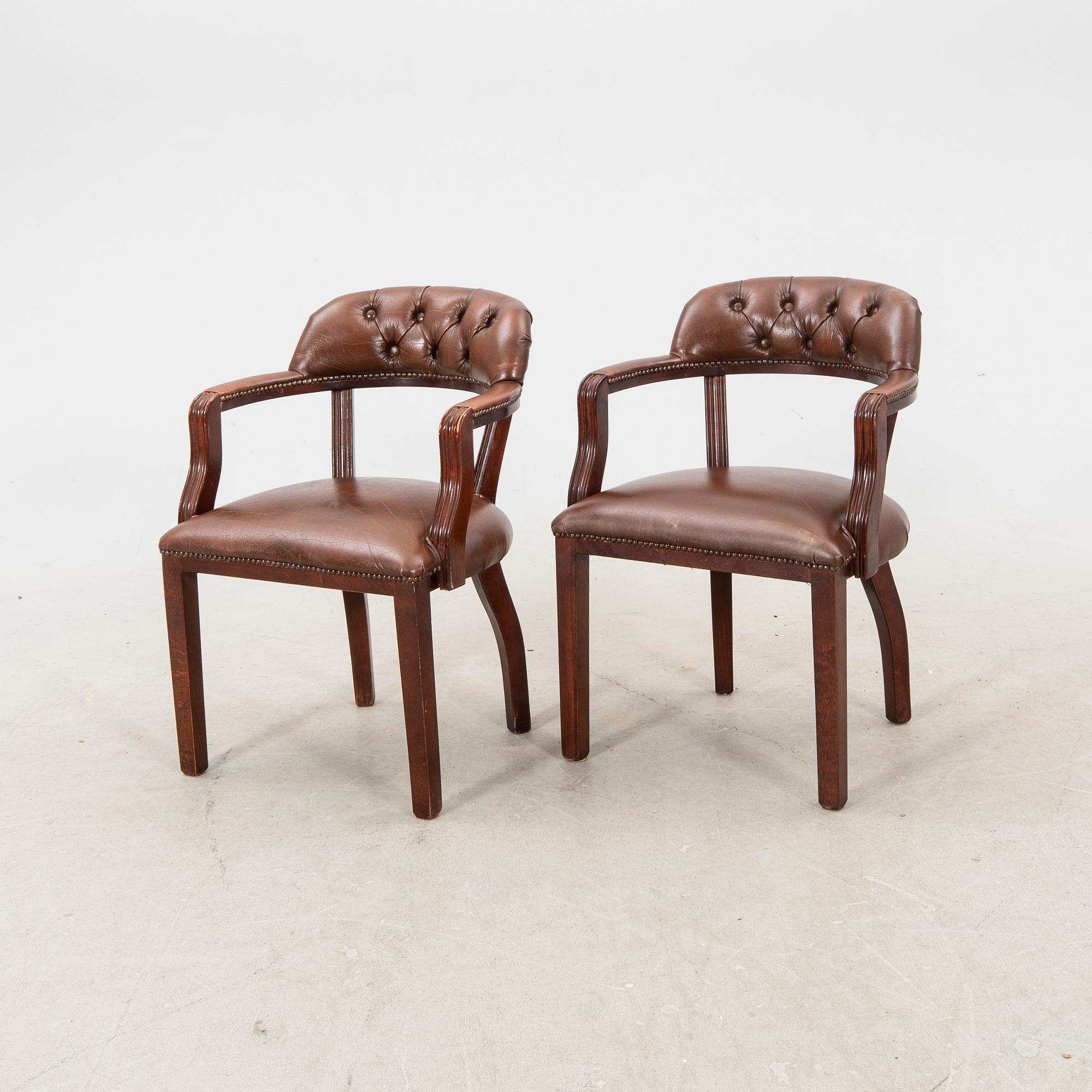 A pair of leather armchairs from the second half of the 20th century.