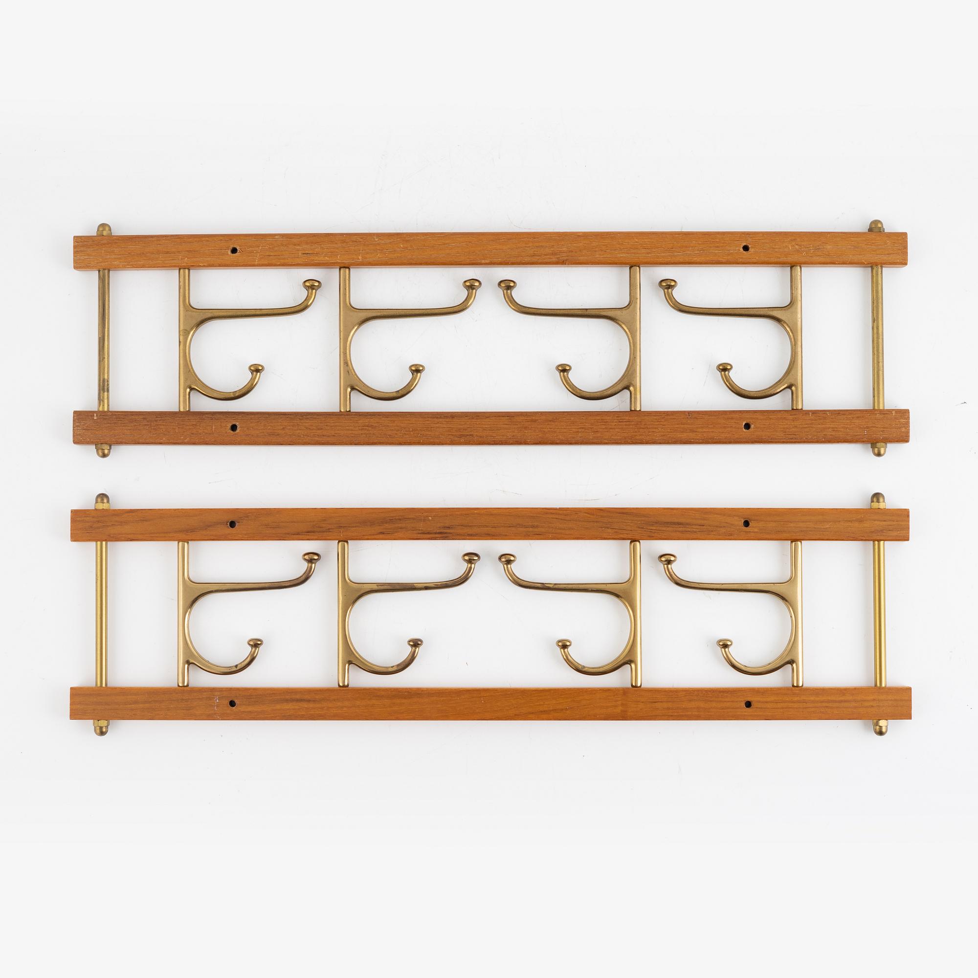 A pair of 'Dekorativ' coat hangers, Skoglunds metallgjuteri, Anderstorp, mid 20th Century.