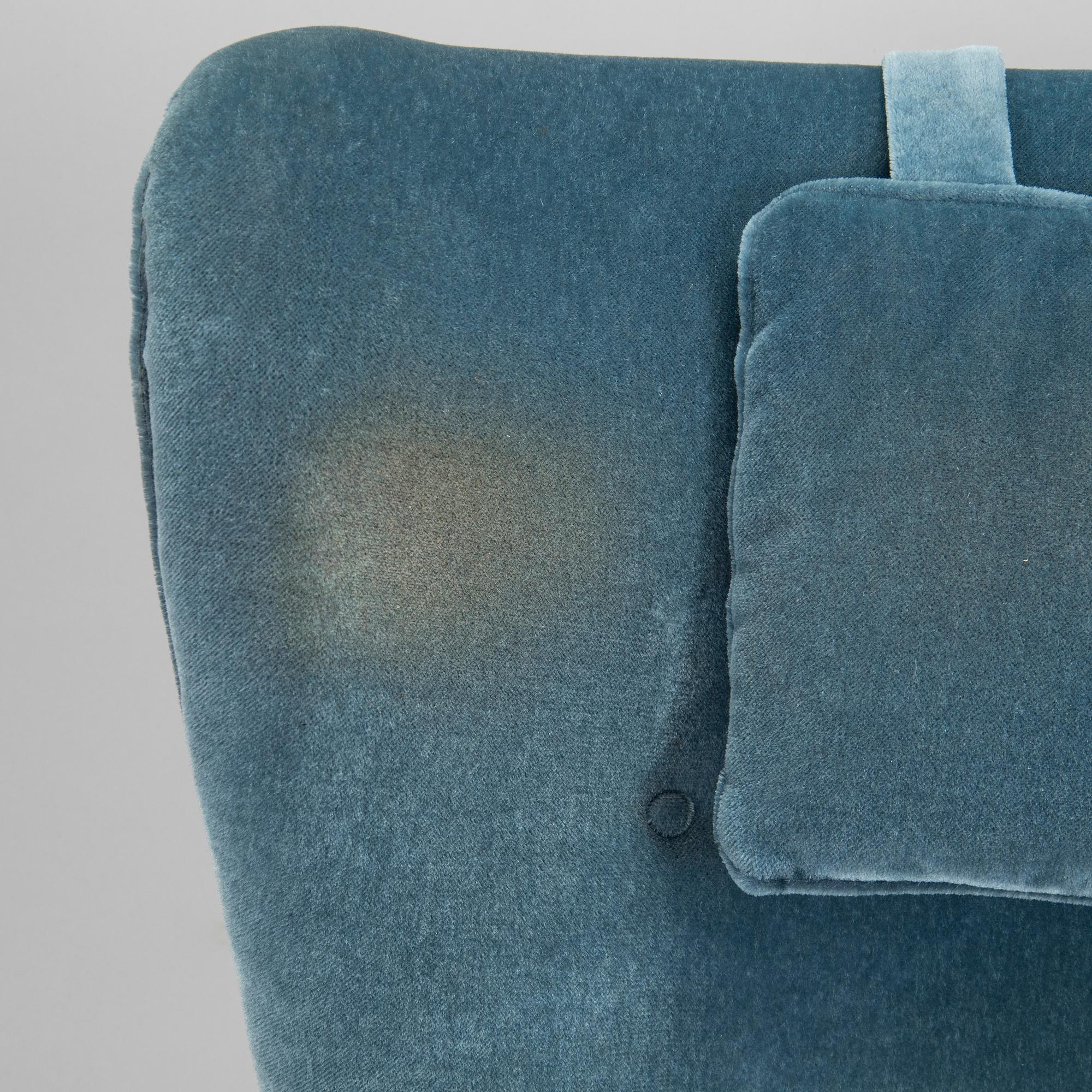 A pair of mid-20th century armchairs.