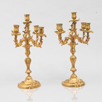 A pair of rococo style candelabras, around 1900.