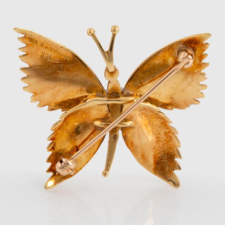 A Tiffany brooch in 18K gold designed as a butterfly.