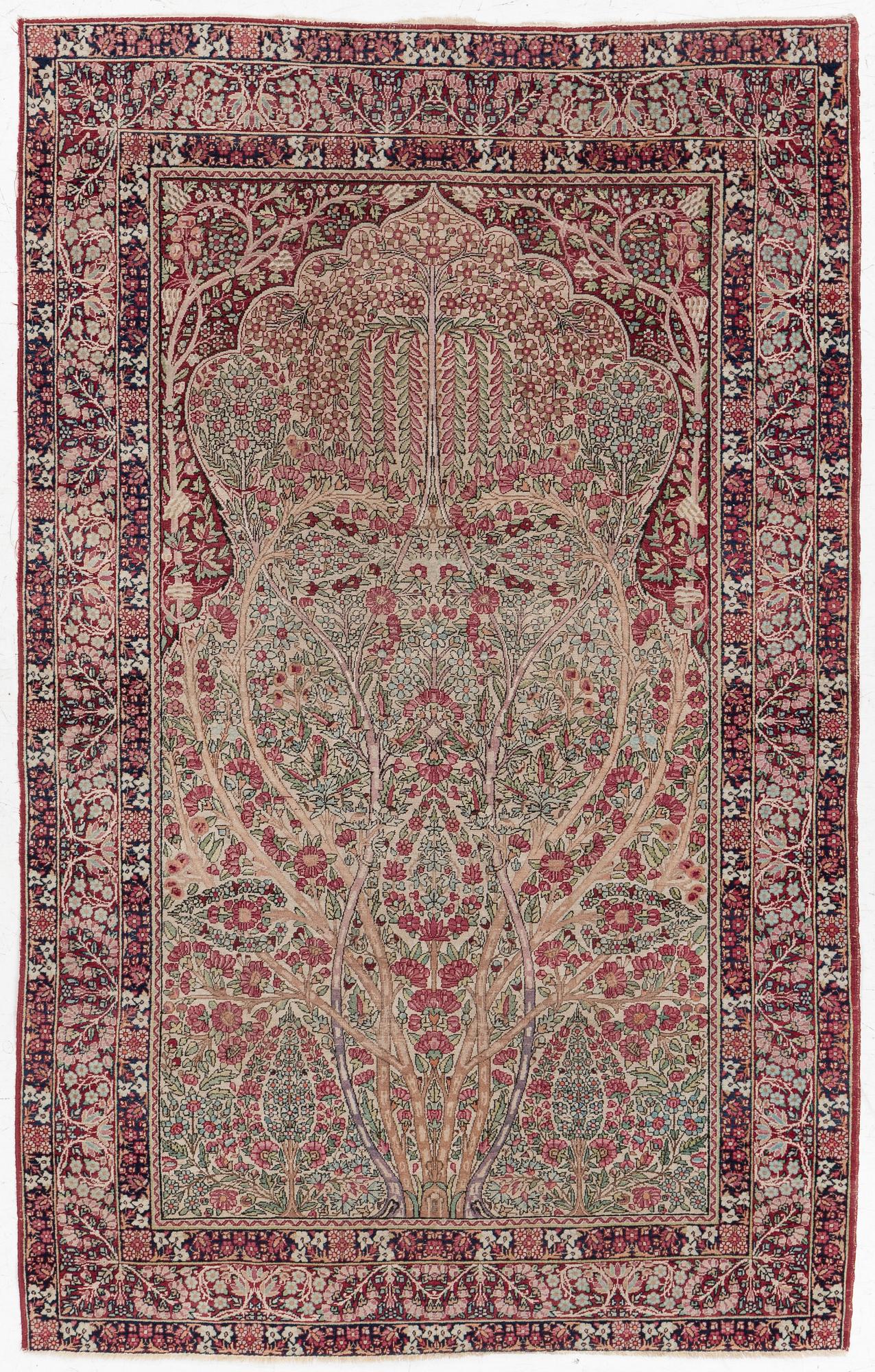 An antique Kirman rug, south Persia, c. 220 x 140 cm.
