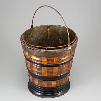 A 19th century brass and wood wine cooler.