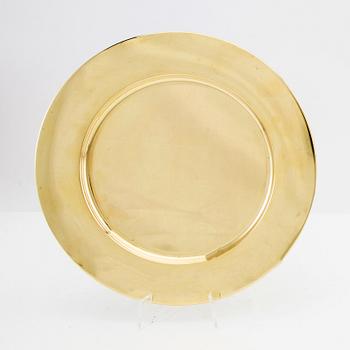 A set of 10 Stelton brass plates, Denmark, late 20th century.