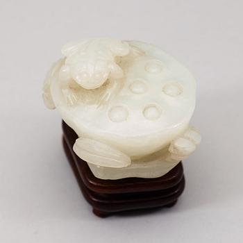 A pale celadon nephrite carving of a lotus pod, Qing dynasty (1644-1912).